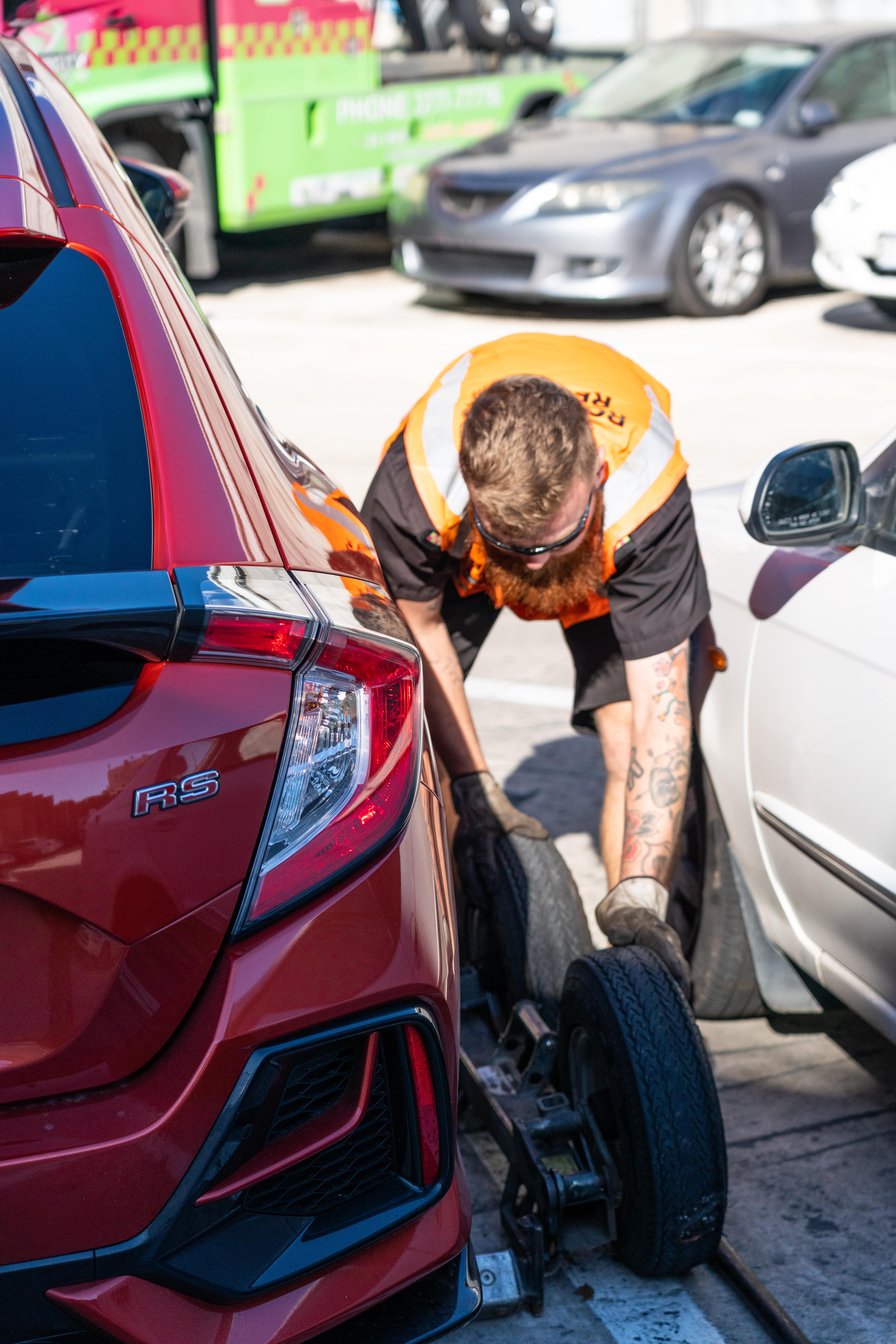 Supercity Towing technician securing a vehicle